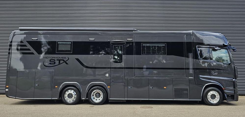 A dark, premium coach-built motorhome — the kind of support vehicle the Coast to Coast Cycle team is looking to borrow for the ride.